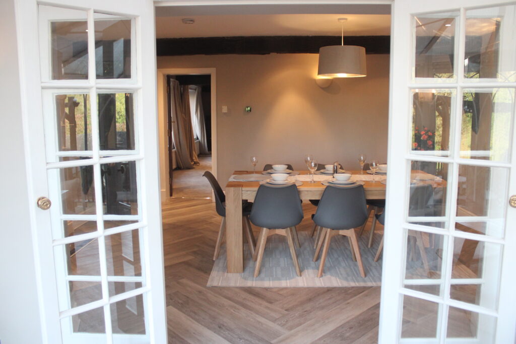 Dining room at Habberjam Farm connected to conservatory and living spaces
