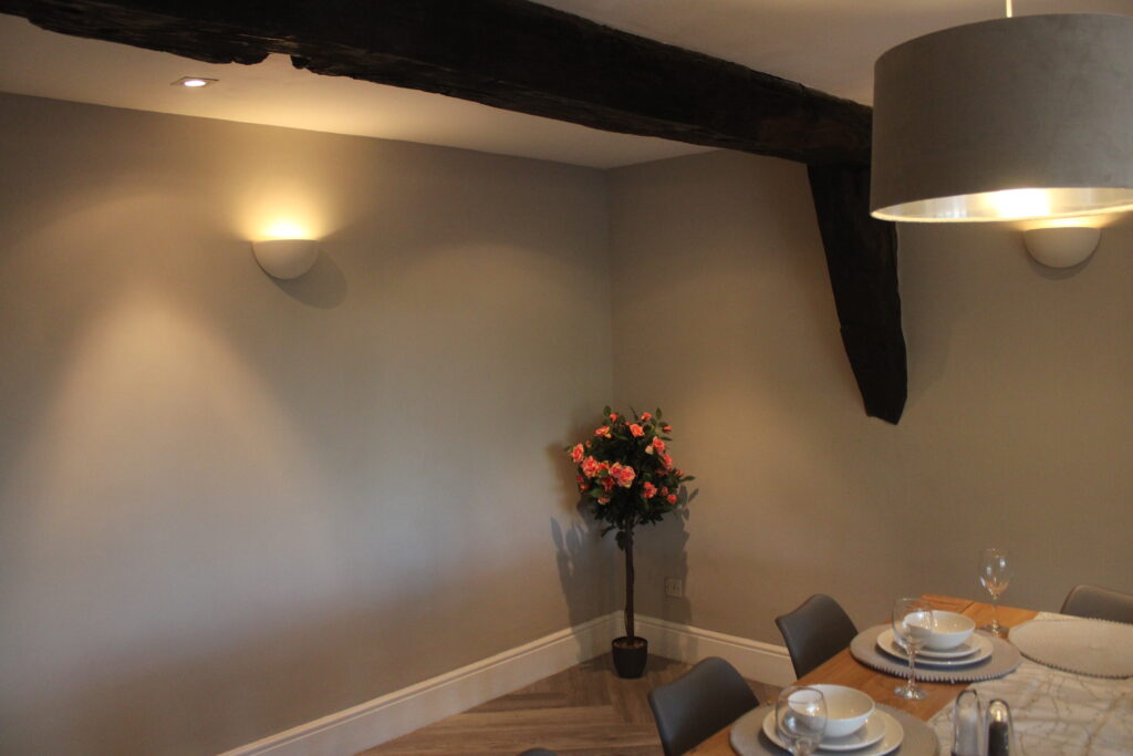 Dining room at Habberjam Farm with original exposed ceiling beam