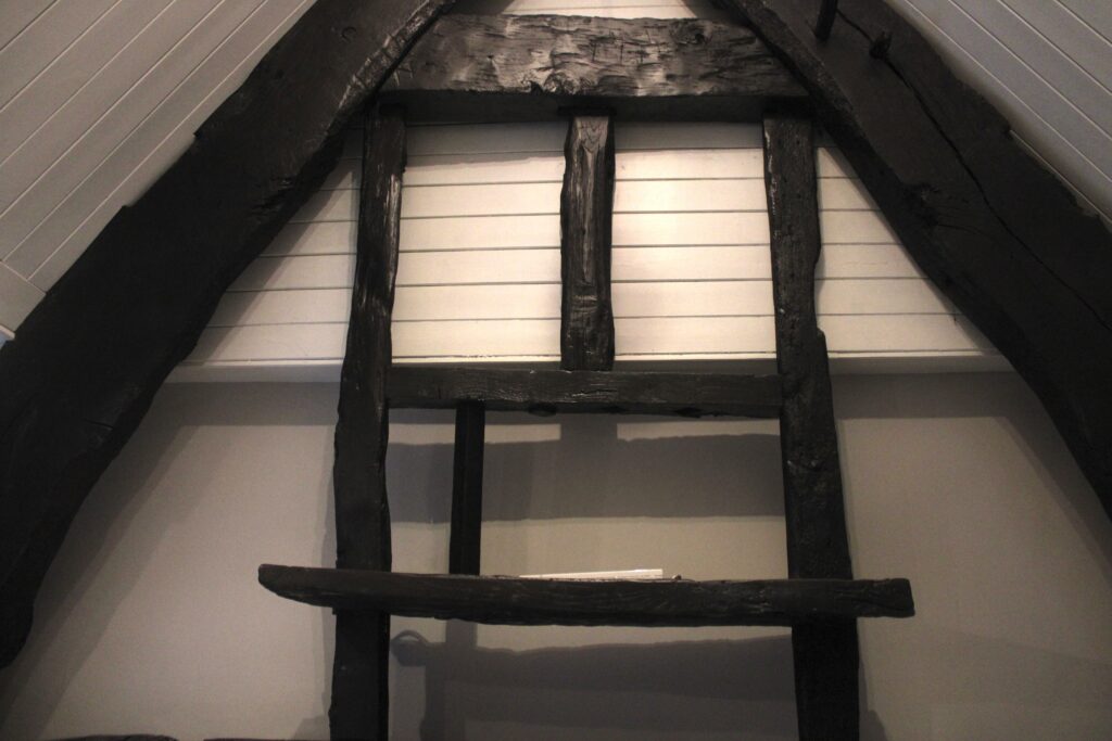 Historic exposed beams in third-floor bedroom at Habberjam Farm