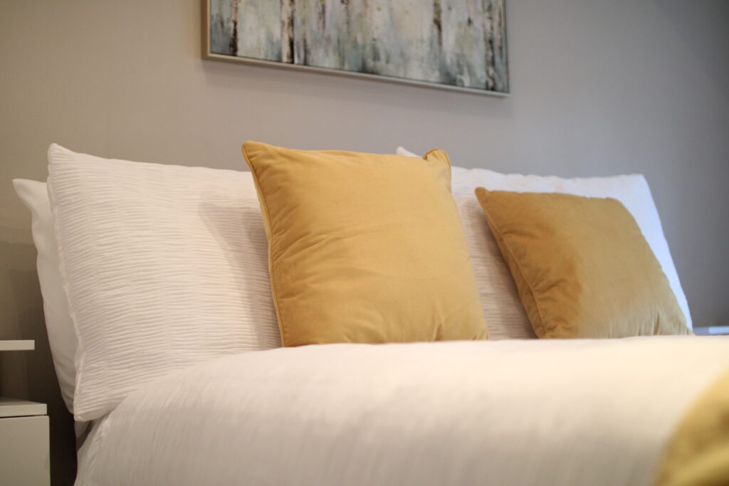 Light-filled bedroom with soft furnishings at Habberjam Farm